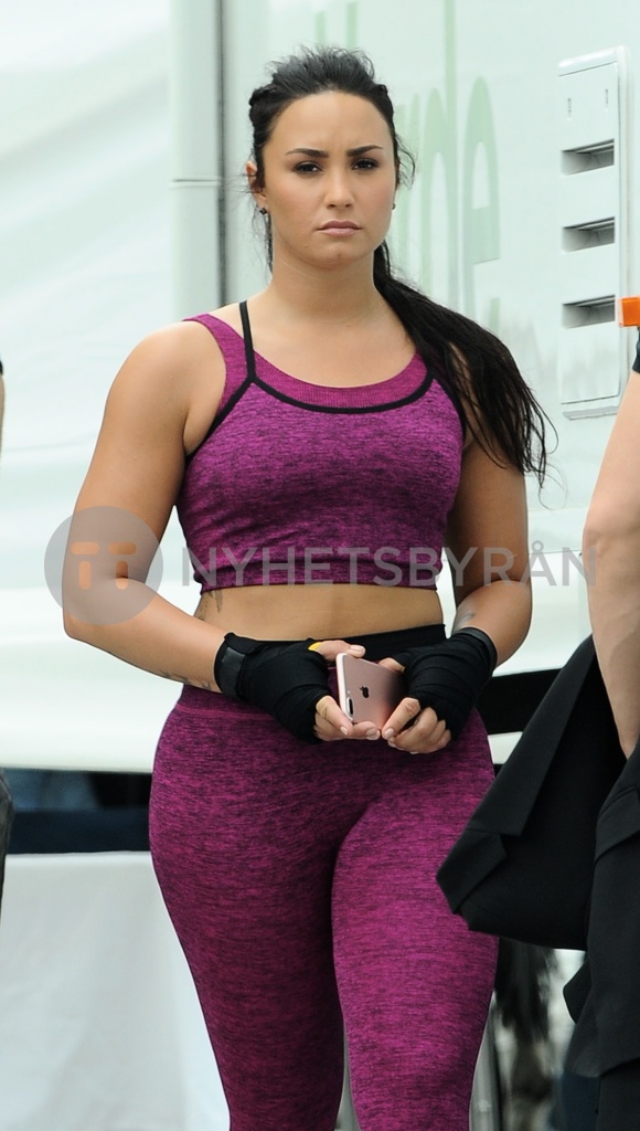 Demi Lovato Shoots Fabletics Commercial in Purple Workout Gear and Black  Sneakers