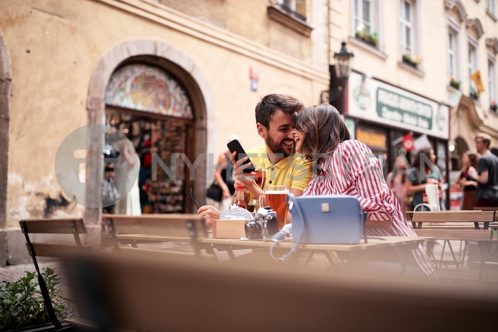 Beautiful Young Couple Having A Good Time On Street Cafe In Prag beautiful-young-couple-having-a-good-time-on-street-cafe-in-prag