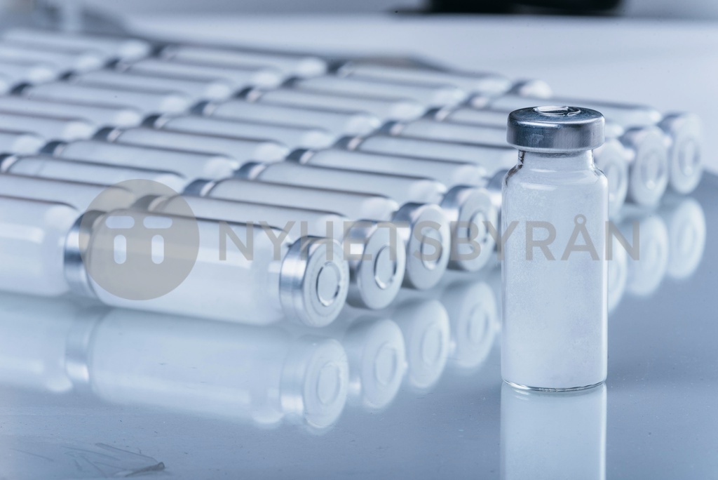 Glass medical ampoule vial for injection. Medicine is dry white drug