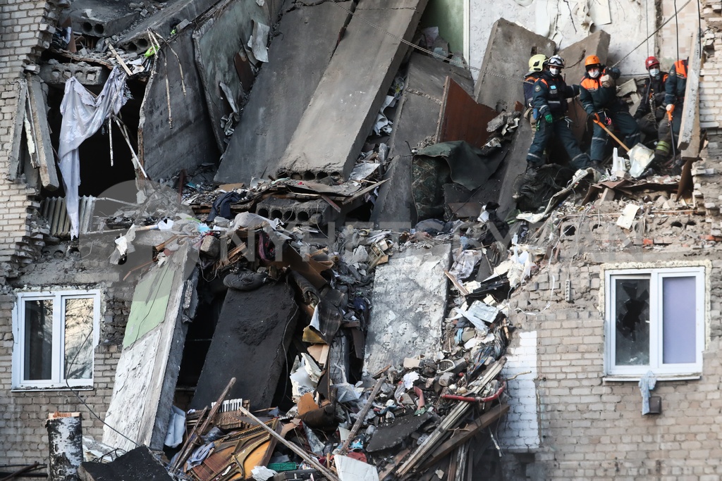 Domestic gas explosion causes apartment building section to coll