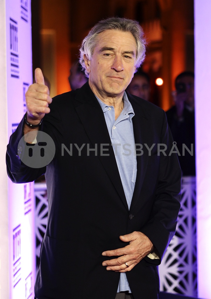 Actor Robert De Niro gives a thumbs-up as he arrives at the 