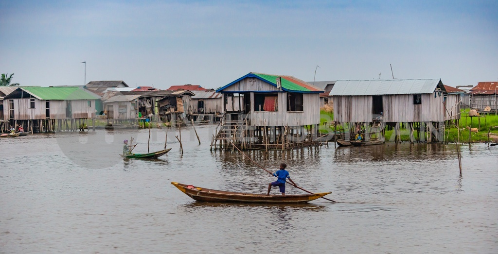 Benin lakeside city ganvie inhabitants travelling boat downtown